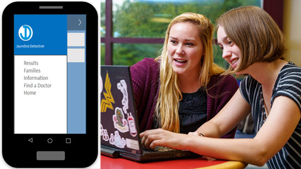 Two female students demonstrating mobile app