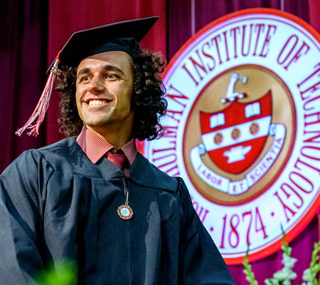 !student in graduation cap and gown