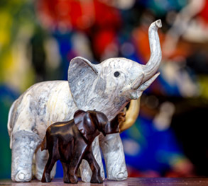 Image shows two small decorative elephants. 