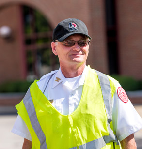 Public safety officer directing traffic on campus.
