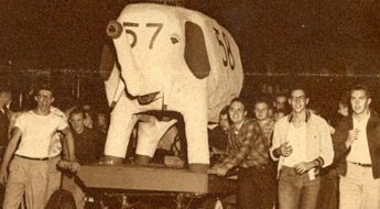 Vintage black and white photo of students with elephant float