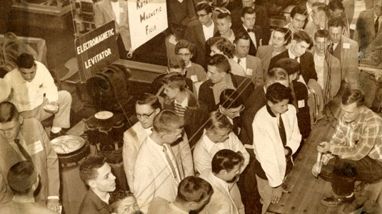 Historical photo showing students demonstrating projects at the Rose Show.