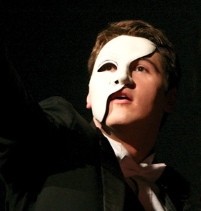 Student with mask acting in Phantom of the Opera