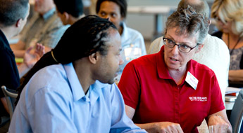 Professors take part in small group discussions during a MACH session