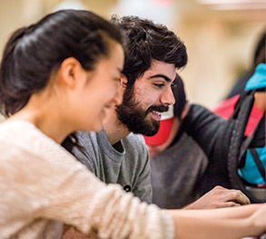 Image of students smiling.