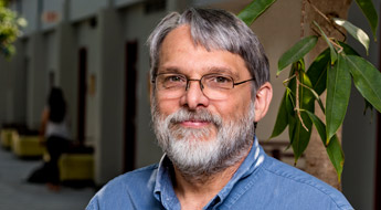 !A smiling Dr. Rob Bunch standing outdoors at Rose-Hulman