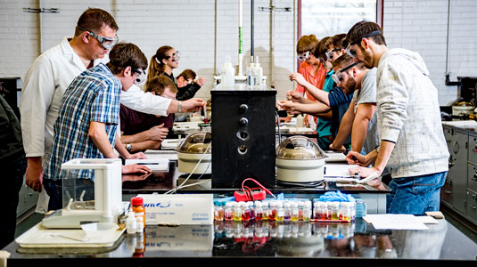 Students work on an experiment in a chemistry lab.