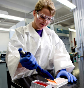 Female student prepares DNA samples for testing.