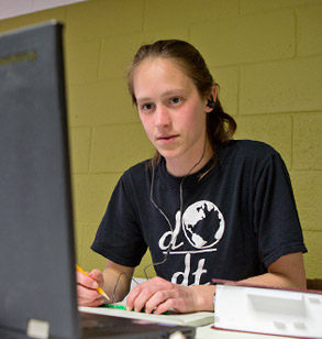 Engineers Without Borders student working in a campus computer lab.