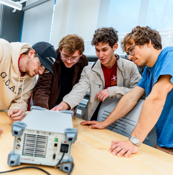 Two Engineering Management students are discussing a class project.