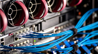 Numerous wires plugged into a computer system.