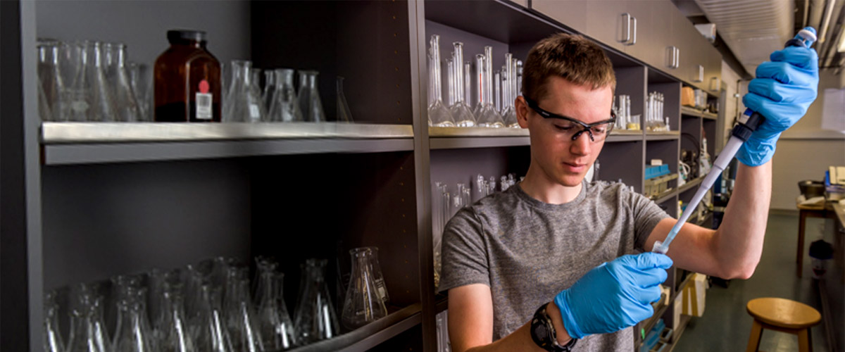 Female student working in a lab.