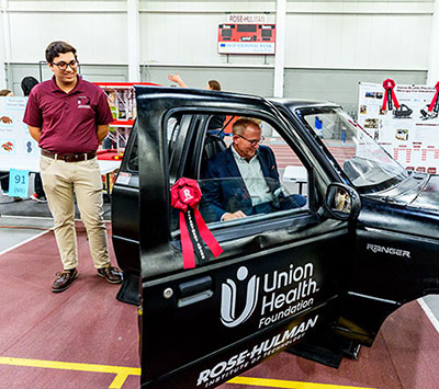 student showing project to client