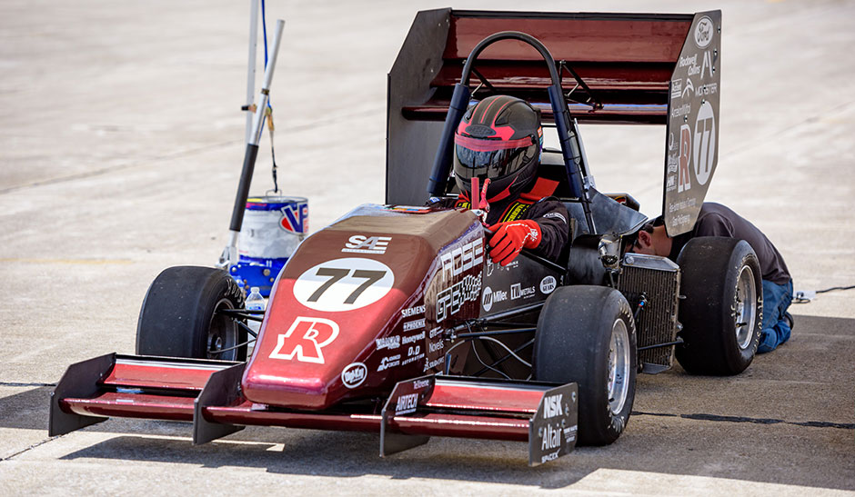 Student in car on airport track