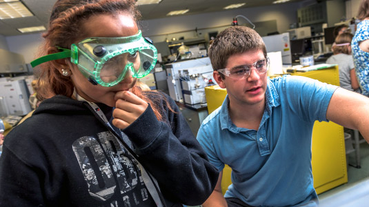 Rose-Hulman student demonstrates lab activities to younger student during the Explore Engineering STEM Fair