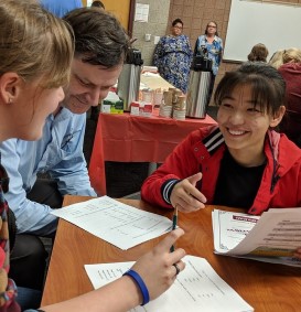 A female tutor helping a female international student.