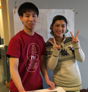 Male and female international students smiling at a party.