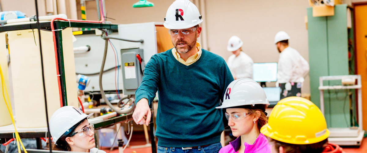 Students and faculty working together in class.