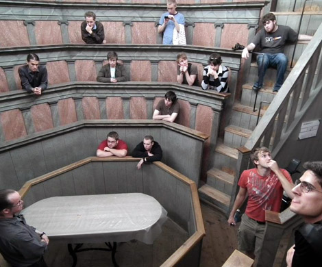 Students seated in a round theater listening to an instructor doing a study abroad experience.