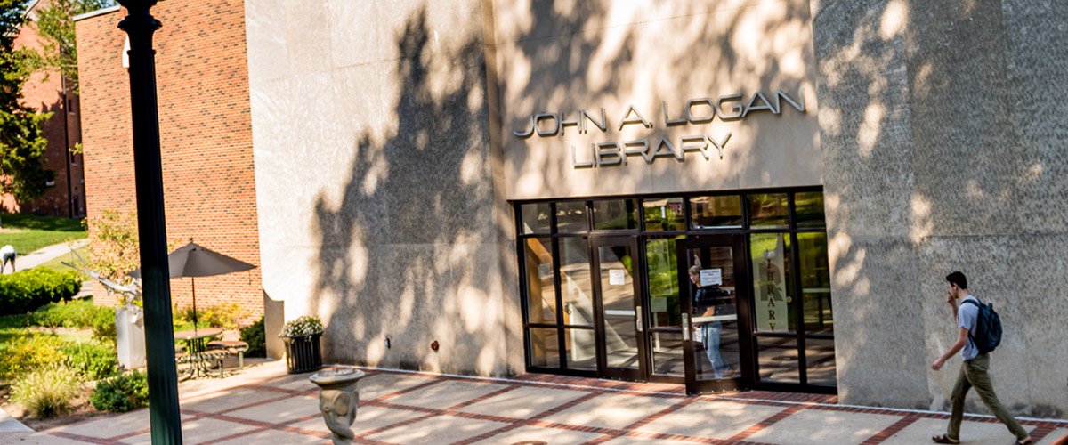 Entrance of the Logan Library on a sunny day. 
