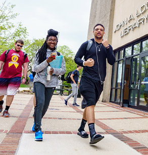 Students walking in front of Logan Library on the Rose-Hulman campus.