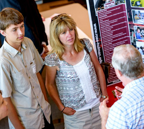 image of family talking to college rep