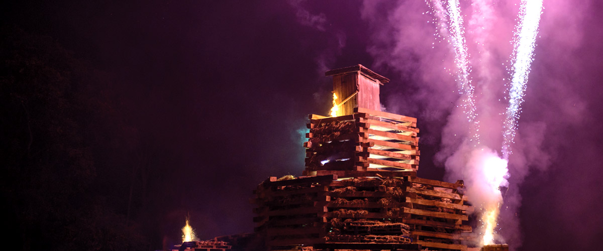 bonfire structure with fireworks shooting out