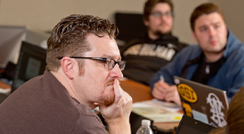 Students listening to a lecturer.