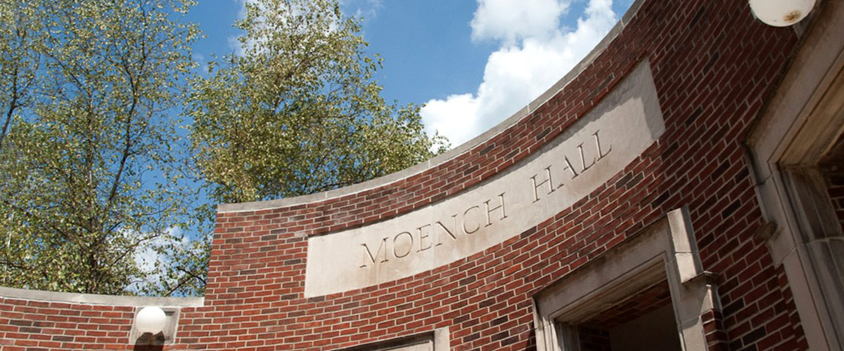 The entrance to Moench Hall against a blue sky. Moench Hall is one of the academic buildings on the Rose-Hulman campus and home to several academic departments and their faculty.