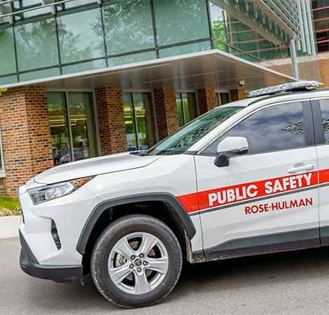 Public Safety officer directing traffic during freshman move-in day.