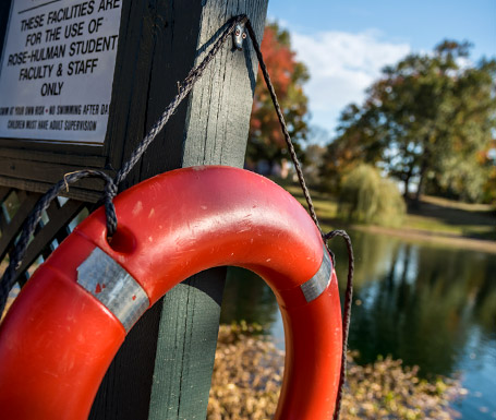 Close-up of a life preserver near a campus lake.