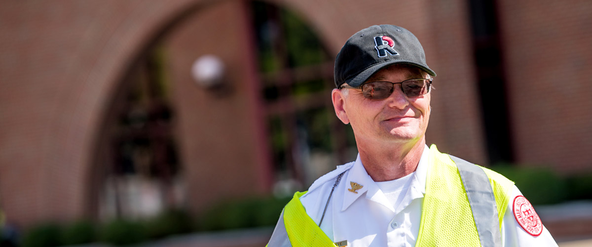 Public safety officer wearing a Rose-Hulman cap and reflective vest.