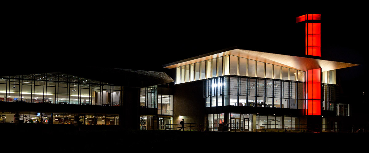 Computer-generated image of the renovated Mussallem Union building at night.