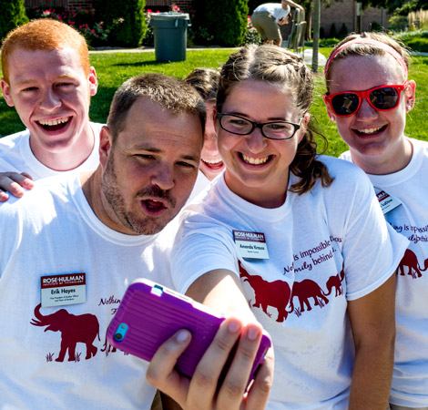 Vice President of Student Affairs Erik Hayes poses for a selfie with members of the residence life staff during move-in day.
