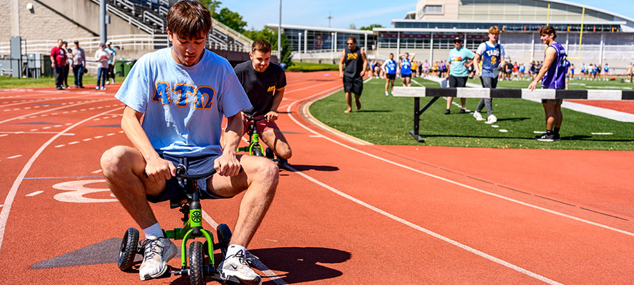 A member of ATO competes in the Greek Games at Rose-Hulman.