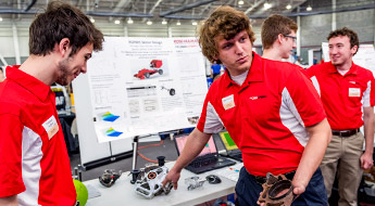 !Senior design team members explain project at Career Fair.