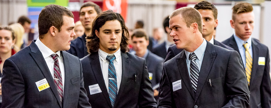 Students dressed in business attire for the career fair