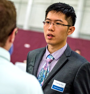 Student meets with company recruiters at Career Fair.