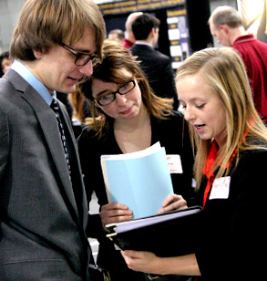 Student meets with company recruiters at Career Fair