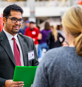 Student meets with company recruiters at Career Fair.