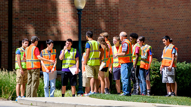 Civil engineering students performing tests on concrete