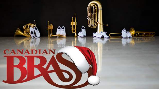 Brass instruments sitting on a stage with white sneakers and Canadian Brass logo