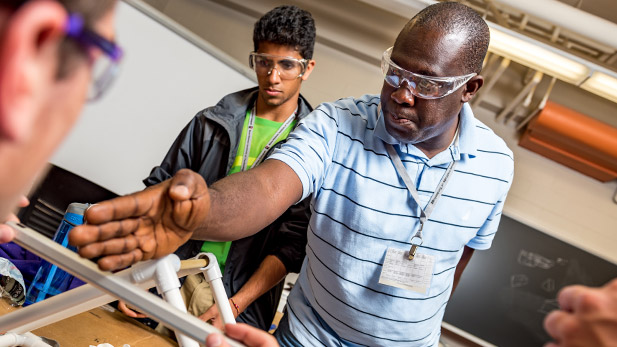 John Aidoo in a classroom with students