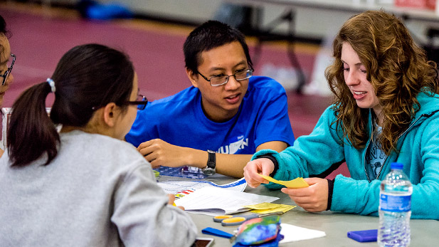 Male student working on a project at the SPARK event