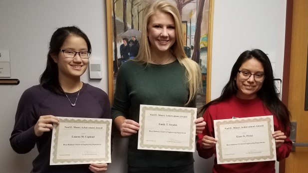 Three students holding their Noel Moore award certificates.