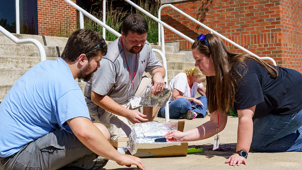 Teachers perform experiments with solar cells during the Sustainable Energy Summer Institute