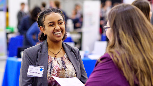 Student meeting with a recruiter during career fair