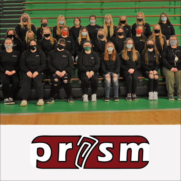 Image shows large group of West Vigo female students seated in a gymnasium wearing black EMERGE sweat shirts and COVID-19 masks. 