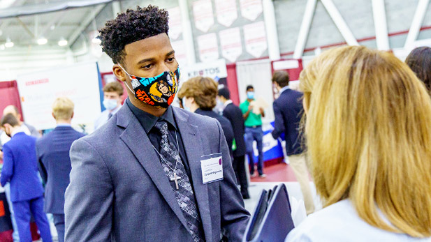 Students speak with employers at the Rose-Hulman Career Fair.