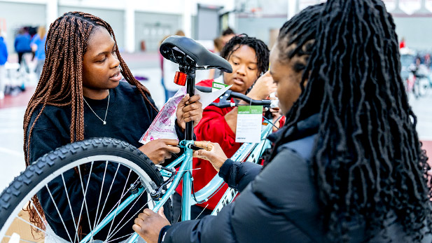 Rose-Hulman students assemble a bicycle.